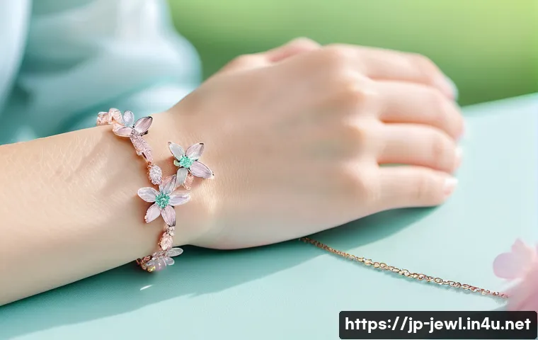 스와로브스키 팔찌 세트 추천 - A close-up image of a delicate Swarovski bracelet featuring a slim silver chain adorned with small p...