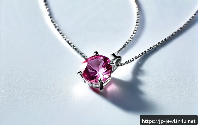 스와로브스키 목걸이 라인업 - A close-up image of a delicate Swarovski necklace featuring a slender silver chain with a single spa...